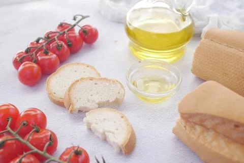 Slice of whole meal bread and olive oil on table Foto stock
