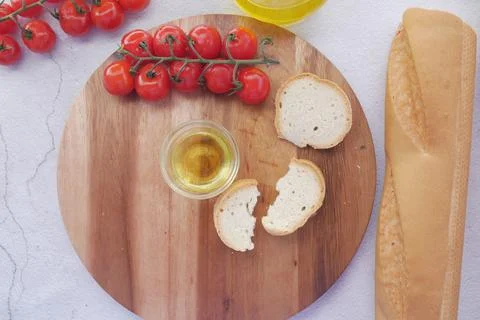 Slice of whole meal bread and olive oil on table Foto stock