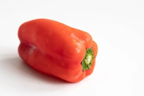 Slice of yellow bell pepper on a black background. Close up. Stock Photos