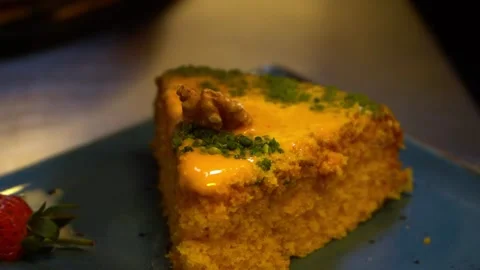 Slice of Yellow Cake on Blue Plate Stock Footage 319949659