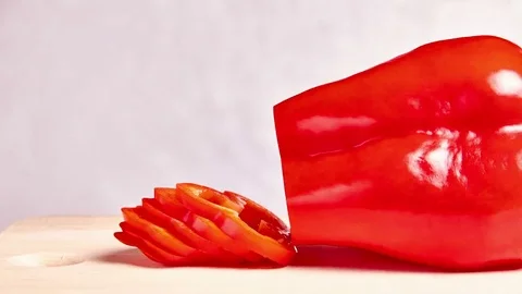 Sliced and falling red pepper - stop motion animation and timelapse Stock Footage 69212886