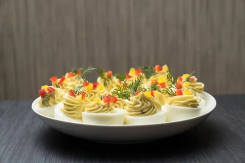 Sliced and filled boiled egg. Concept of food and organic farm products. Stock Photos