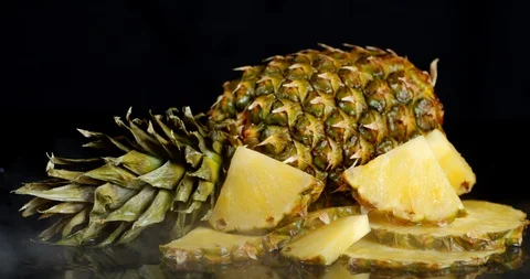 Sliced and whole pineapple with cool steam. Stock Footage 129802444