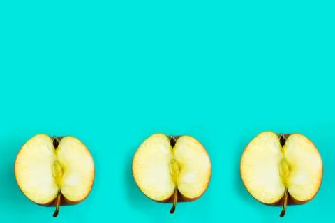 Sliced apple pattern on blue background, copy space for the text, banner Stockfoto's