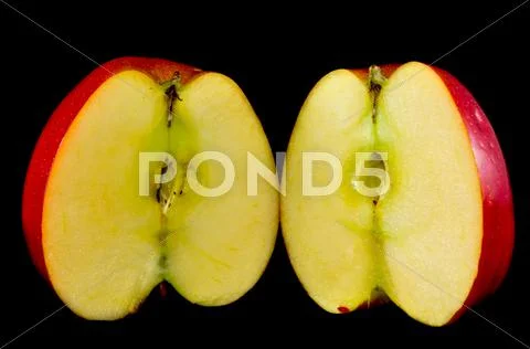 Sliced apples on black background Stock Photos