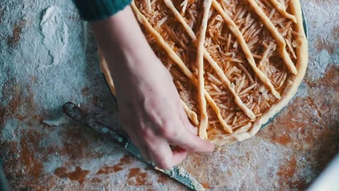 Sliced apples on cake batter in baking pan Stock Footage