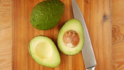 Sliced avocado on cutting board. Stock Footage 238721935