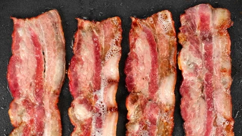 Sliced bacon fried in pan top view, slider shot Stock-Footage 264961848