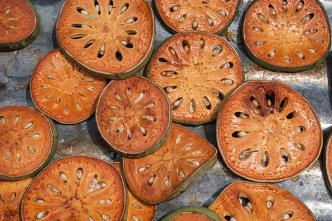 Sliced Bael Fruit Drying in Sun Stock Photos