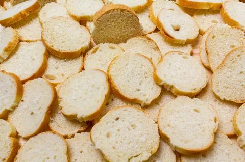 Sliced baguette on the table Stock Photos