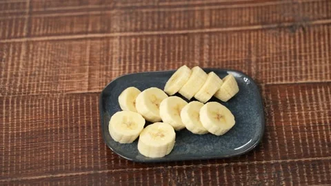 Sliced ​​bananas on a plate Stock Footage 183501691