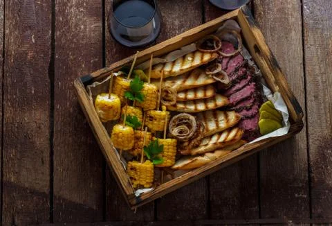 Sliced beef with corn and bread Stock Photos