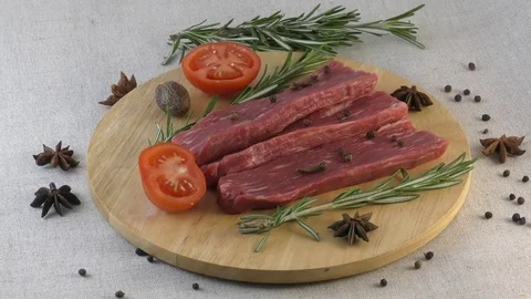 Sliced beef on cutting board Stock Footage 94642357
