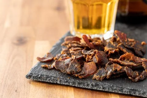 Sliced beef jerky. Dried beef meat. Stock Photos
