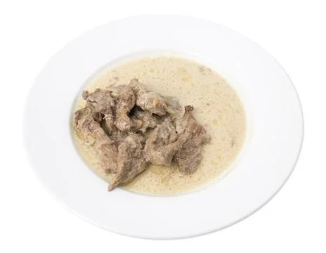 Sliced beef with white sauce. Stock Photos
