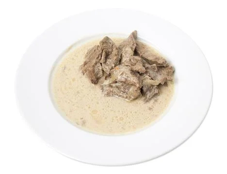 Sliced beef with white sauce. Stock Photos