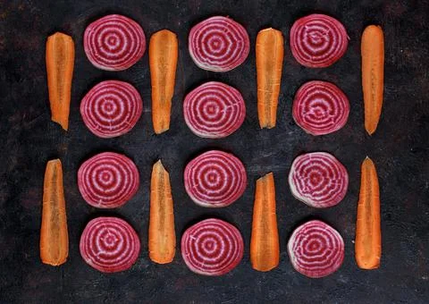 Sliced beetroot and carrot in pattern Stock Photos