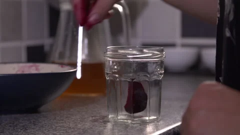 Sliced Beetroot being put in a jar and pickled in vinegar and sealed. Stock Footage 137363145
