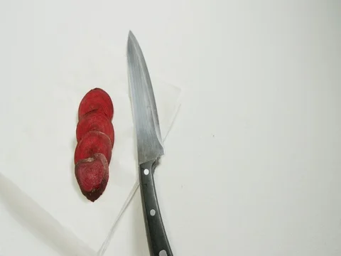 Sliced beetroots and knife on white background 4K 4k Stock Footage 84154773