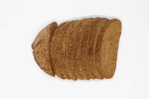 Sliced black bread. Dark rye bread with cumin cut into even pieces on a white Stock Photos