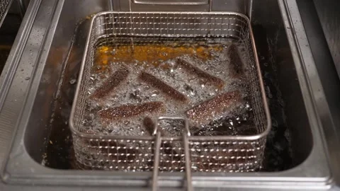 Sliced black bread fried in boiling oil deep-fried in the restaurant kitchen. Stock Footage 259613695