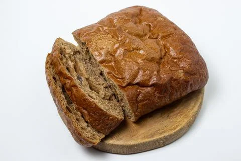 Sliced black bread on a white plate. Borodino bread. Homemade baking.  Stock Photos