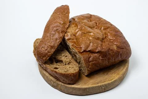 Sliced black bread on a white plate. Borodino bread. Homemade baking.  Stock Photos
