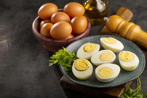 Sliced ??boiled eggs on the table. Stock Photos