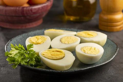 Sliced ??boiled eggs on the table. Stock Photos
