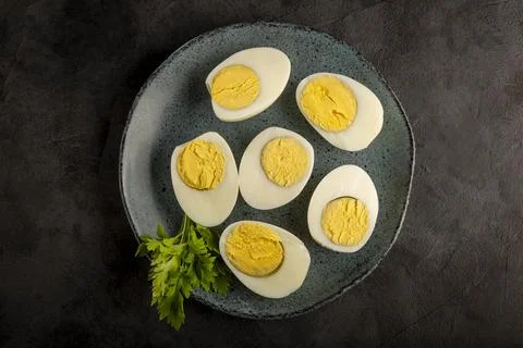 Sliced ??boiled eggs on the table. Stock Photos