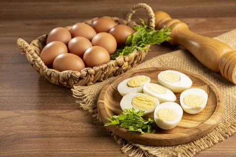 Sliced ??boiled eggs on the table. Stock Photos
