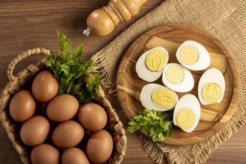 Sliced ??boiled eggs on the table. Stock Photos