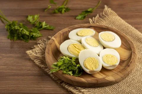 Sliced ??boiled eggs on the table. Stock Photos