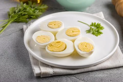 Sliced ??boiled eggs on the table. Stock Photos