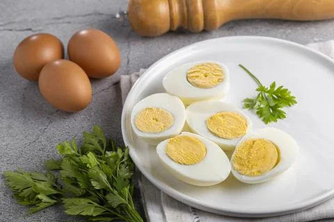 Sliced ??boiled eggs on the table. Stock Photos