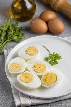Sliced ??boiled eggs on the table. Stock Photos
