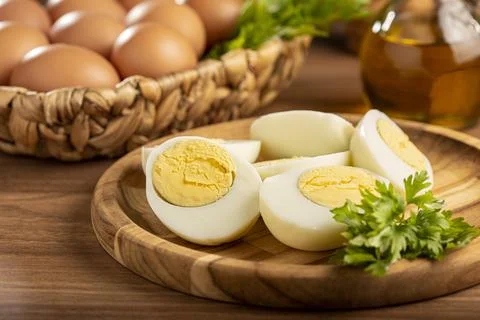 Sliced ??boiled eggs on the table. Stock Photos