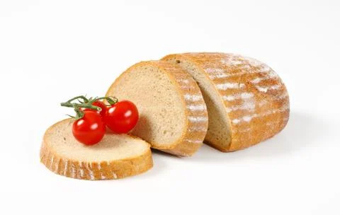 Sliced bread and cherry tomatoes Stock Photos