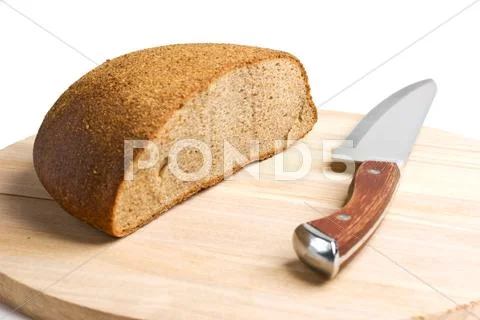 Sliced bread and the knife Stock Photos