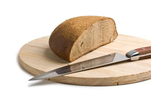 Sliced bread and the knife Stock Photos