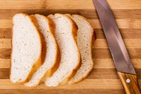 Sliced bread and the knife Stock Photos