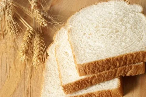 Sliced Bread and Wheat Stock Photos