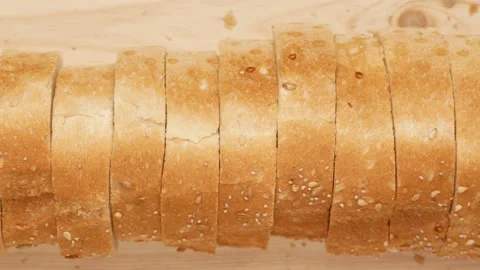 Sliced bread. Baguette on the kitchen board. Stock Footage 148975399