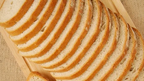 Sliced bread on the board. Stock Footage 247682342