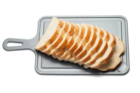 Sliced bread on breadboard isolated over white Stock Photos
