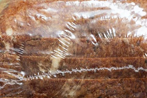 Sliced bread in clear plastic packaging. Close-up of bread slices Stock Photos