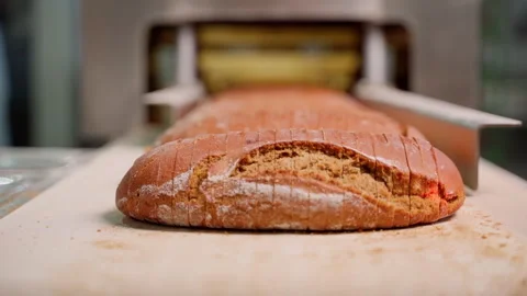 Sliced bread on a conveyor belt. Slow motion Stock Footage 250275134