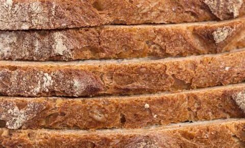 Sliced bread crust detail. Bread background. Stock Photos