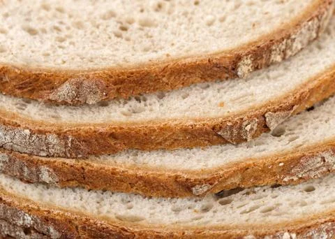Sliced bread crust detail. Bread background. Stock Photos
