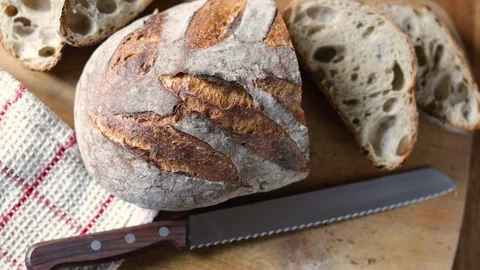 Sliced Bread On A Cutting Board Stock Footage 128676040